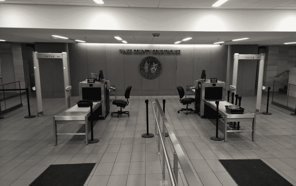 Walk-through metal detector at courthouse entrance